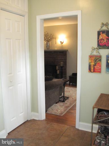 501 South Hammonds Ferry Road Linthicum Heights, MD 21090 - Photo 3 of 30 a view of a livingroom with wooden floor and a fireplace