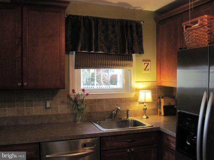 501 South Hammonds Ferry Road Linthicum Heights, MD 21090 - Photo 24 of 30 a kitchen with a sink cabinets and window