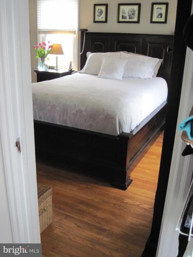 501 South Hammonds Ferry Road Linthicum Heights, MD 21090 - Photo 4 of 30 a bed sitting in a bedroom next to a window