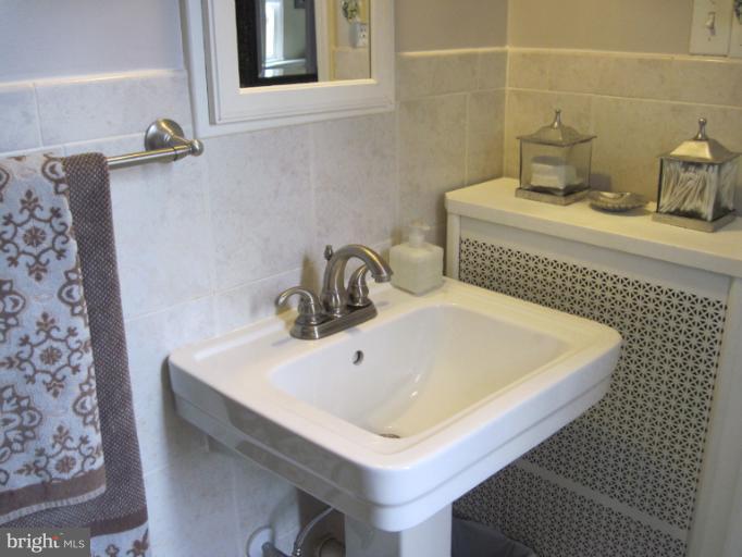 501 South Hammonds Ferry Road Linthicum Heights, MD 21090 - Photo 5 of 30 a bathroom with a sink and a toilet