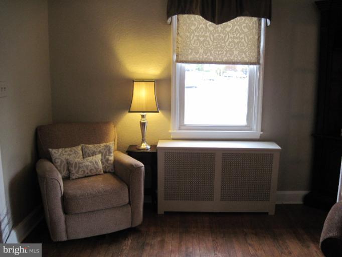 501 South Hammonds Ferry Road Linthicum Heights, MD 21090 - Photo 6 of 30 a living room with a couch and a table