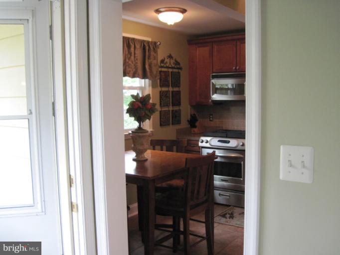 501 South Hammonds Ferry Road Linthicum Heights, MD 21090 - Photo 7 of 30 a kitchen with a table and chairs in it