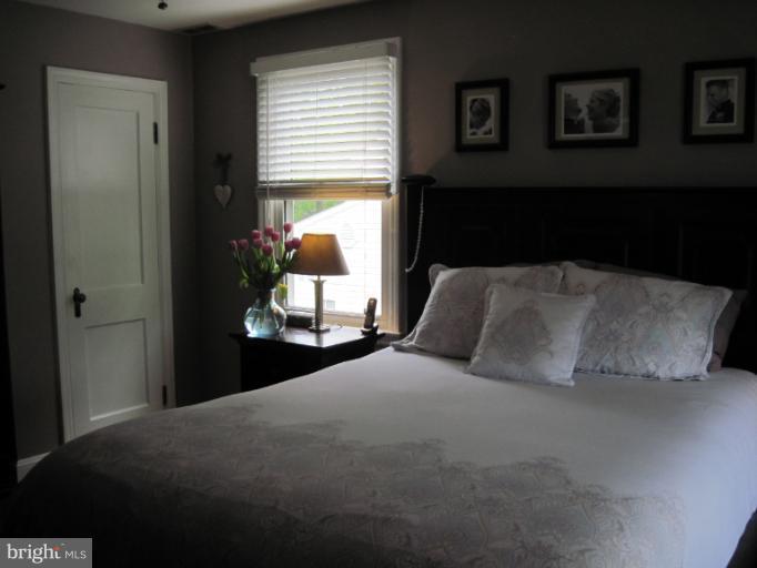 501 South Hammonds Ferry Road Linthicum Heights, MD 21090 - Photo 9 of 30 a bedroom with a bed and window