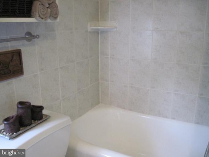 501 South Hammonds Ferry Road Linthicum Heights, MD 21090 - Photo 10 of 30 a bathroom with a bathtub