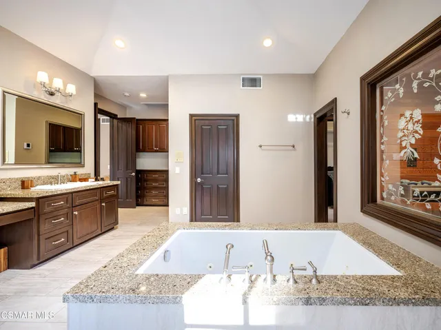 a view of a dining room with furniture wooden floor and chandelier