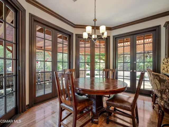 a large kitchen with granite countertop a large counter top cabinets appliances and a center island