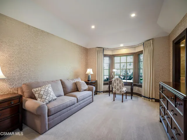 a bathroom with double vanity sinks and a mirror