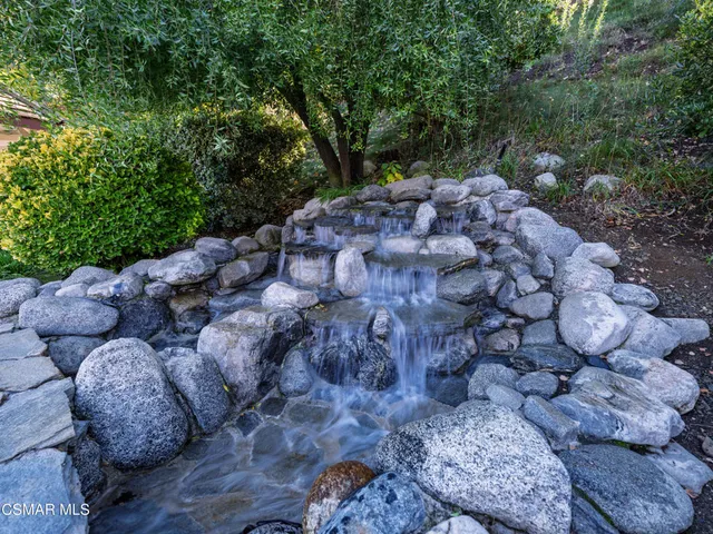 a view of a lake with a house in the background