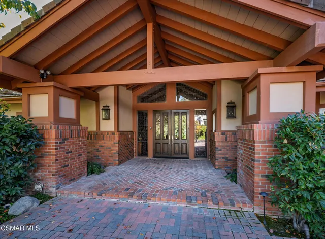 a room with a bed and wooden floor