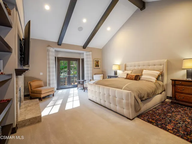 a large kitchen with stainless steel appliances lots of counter top space