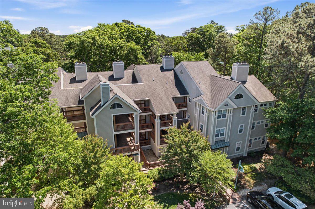 1126 Back Creek Loop, Unit 1126 Solomons, MD 20688 - Photo 4 of 47 aerial view of a house with a yard and large trees