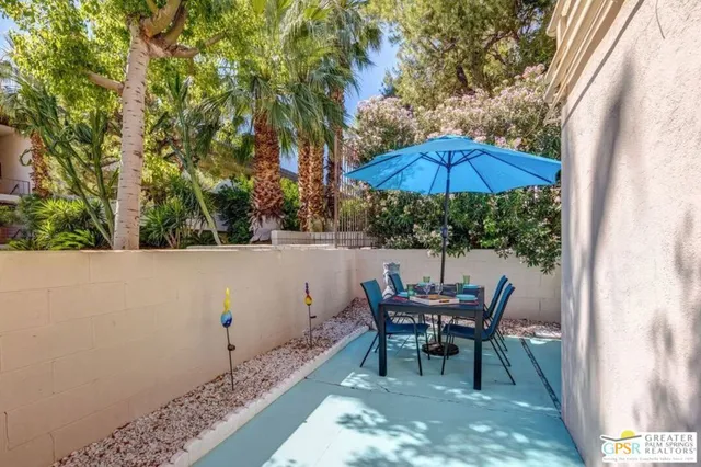 a view of an outdoor sitting area with furniture