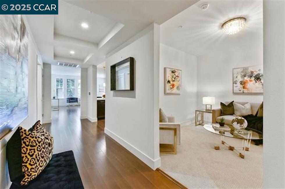 1000 Dewing Avenue, Unit 301 Lafayette, CA 94549 - Photo 15 of 20 a hallway with furniture and wooden floor
