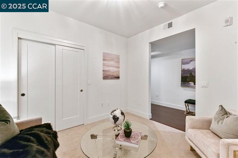 1000 Dewing Avenue, Unit 301 Lafayette, CA 94549 - Photo 16 of 20 a living room with furniture and a mirror