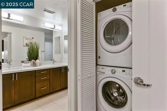 a view of a hallway with washer and dryer