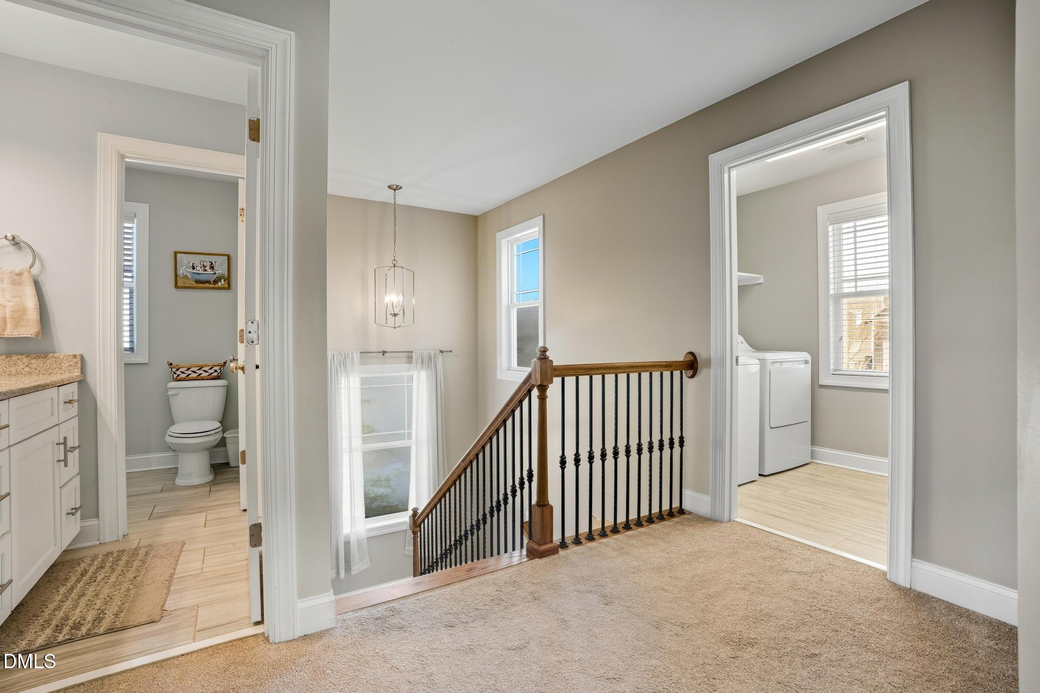 141 Vibernum View Four Oaks, NC 27524 - Photo 9 of 18 a view of a hallway with a livingroom and a bathroom