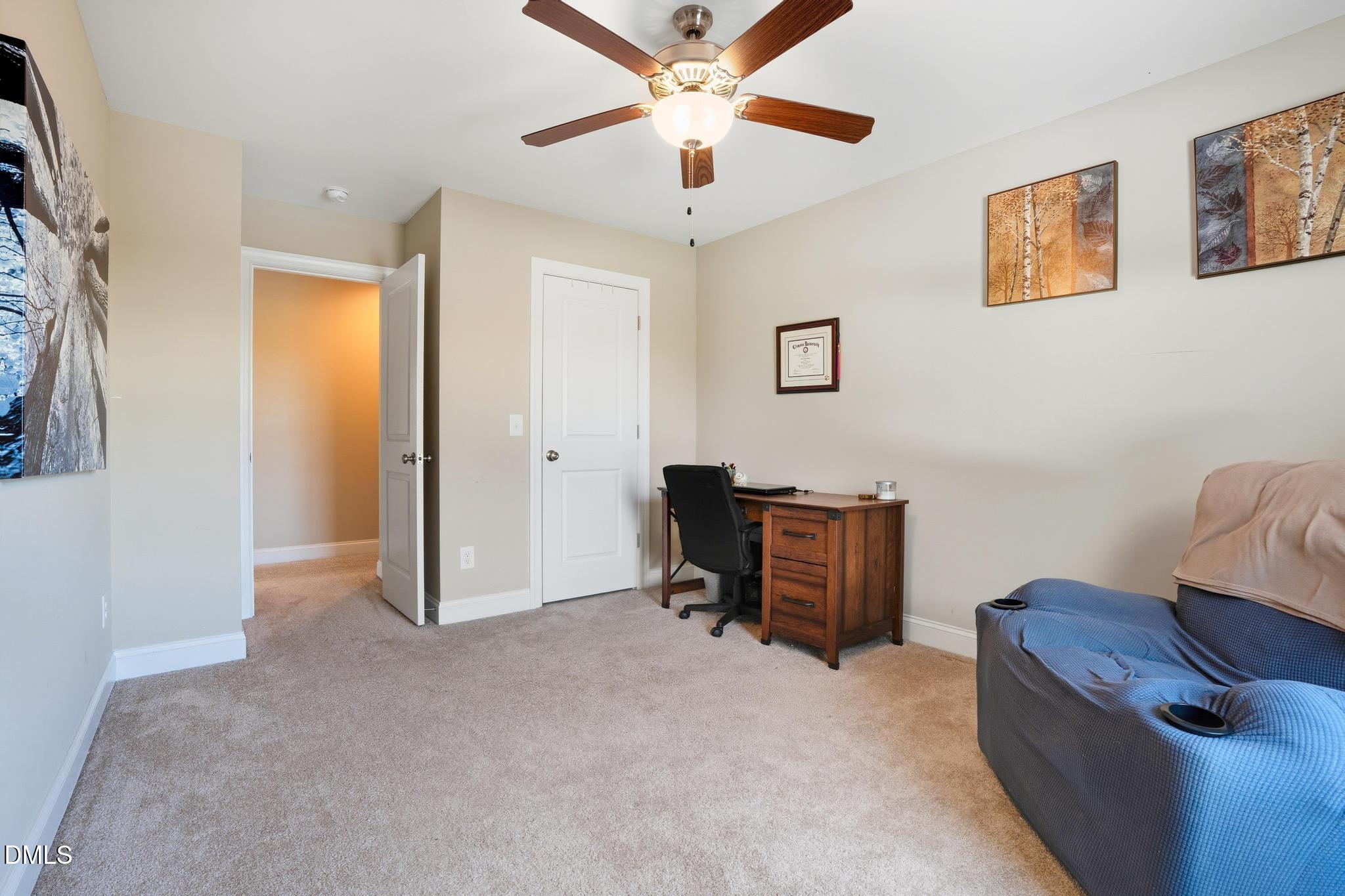 141 Vibernum View Four Oaks, NC 27524 - Photo 11 of 18 a view of a livingroom with furniture and a ceiling fan