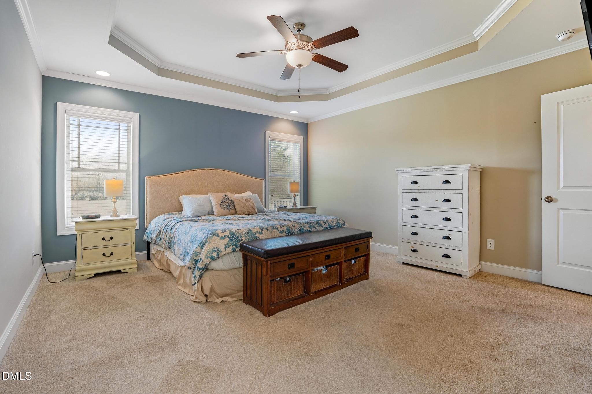 141 Vibernum View Four Oaks, NC 27524 - Photo 6 of 18 a spacious bedroom with a bed and a ceiling fan