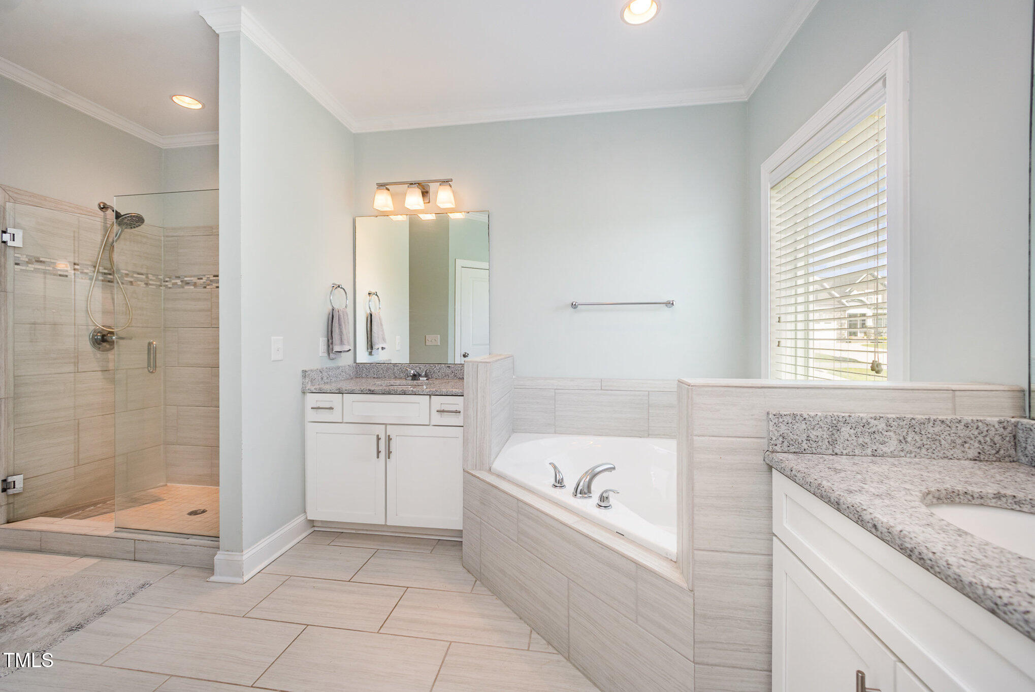 141 Vibernum View Four Oaks, NC 27524 - Photo 7 of 18 a bathroom with a granite countertop tub sink and mirror