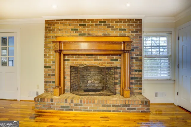 a view of a living room with a fireplace