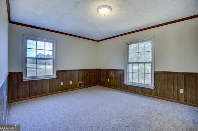 an empty room with windows