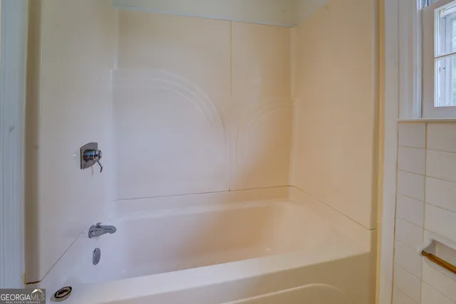 a close view of a bathtub in bathroom