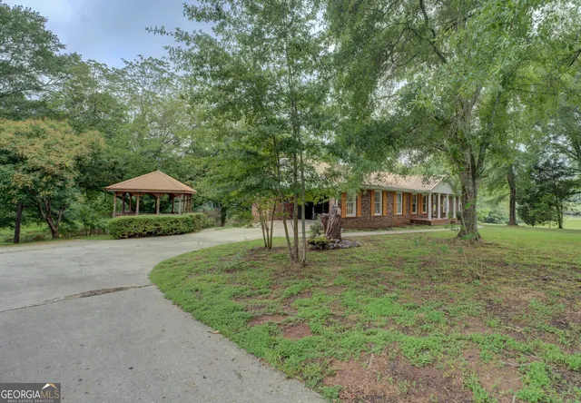 a front view of a house with garden