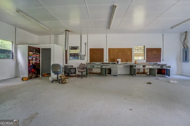 a view of a livingroom with furniture and a flat screen tv