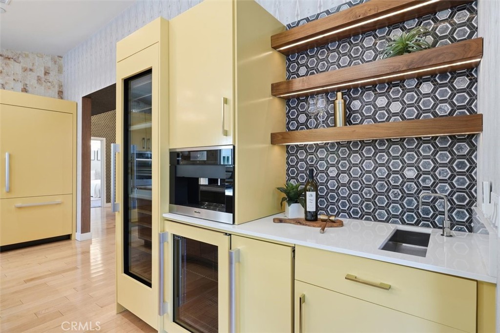 1205 Bryant Road Long Beach, CA 90815 - Photo 17 of 69 a kitchen with a refrigerator and a sink