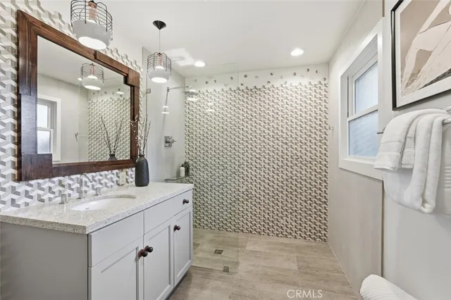 a bedroom with a large bed and a large window