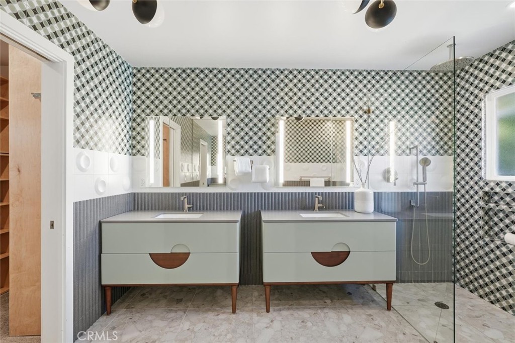 1205 Bryant Road Long Beach, CA 90815 - Photo 30 of 69 a bathroom with a sink and a mirror