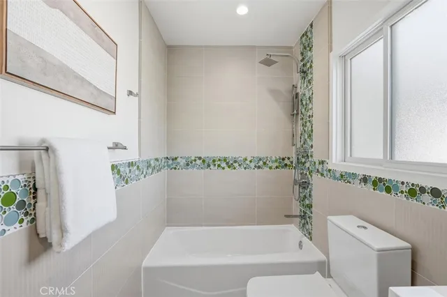 a view of backyard of house with green space