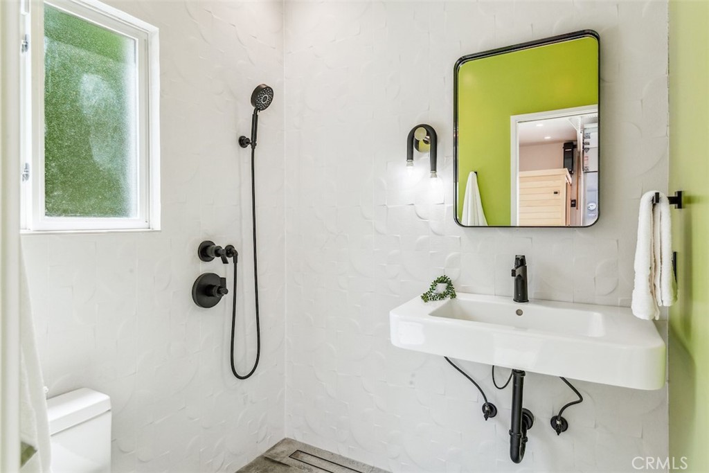 1205 Bryant Road Long Beach, CA 90815 - Photo 53 of 69 a bathroom with a sink and a mirror