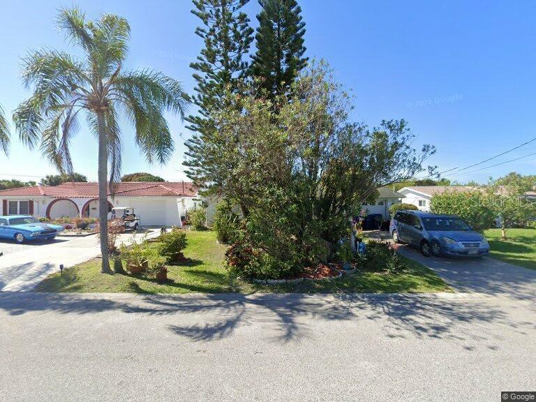 3924 Headsail Drive New Port Richey, FL 34652 - Photo 1 of 1 a view of a yard with plants and trees