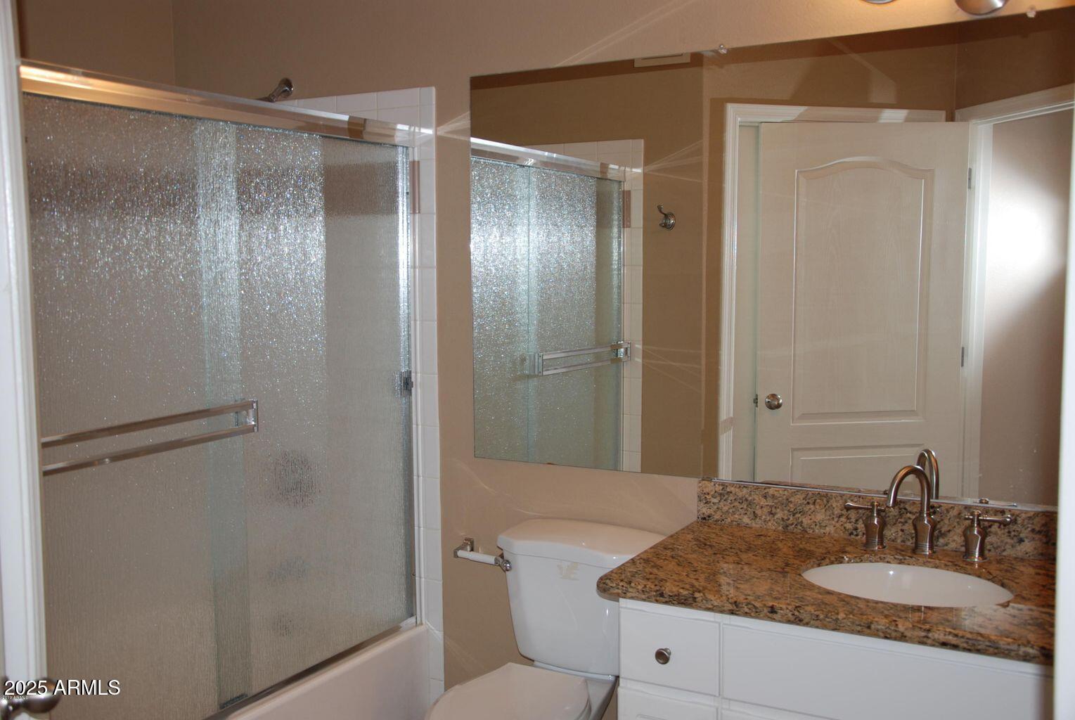 1701 East Colter Street, Unit 378 Phoenix, AZ 85016 - Photo 12 of 41 a bathroom with a granite countertop shower sink vanity and mirror