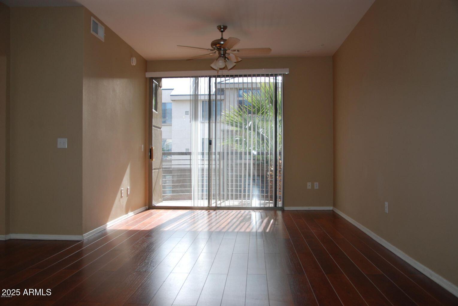 1701 East Colter Street, Unit 378 Phoenix, AZ 85016 - Photo 3 of 41 wooden floor in an empty room with a window