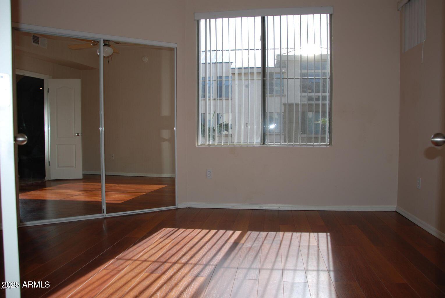 1701 East Colter Street, Unit 378 Phoenix, AZ 85016 - Photo 7 of 41 a view of a room with wooden floor and a window