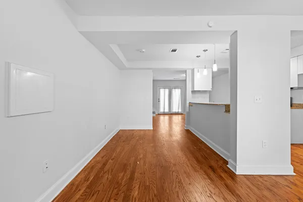 an empty room with closet and fan