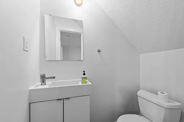 a bathroom with a shower and a sink