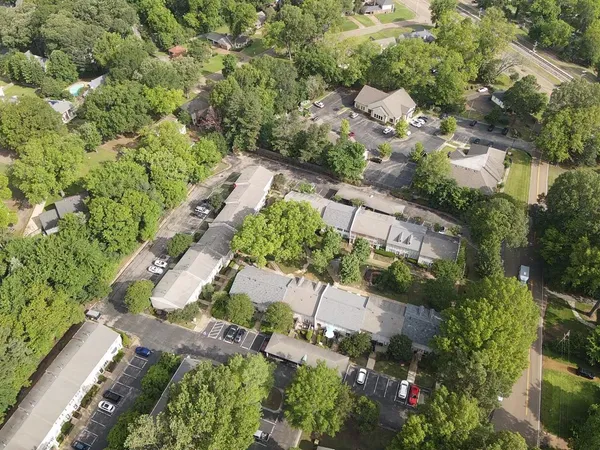 a view of a swimming pool with a yard