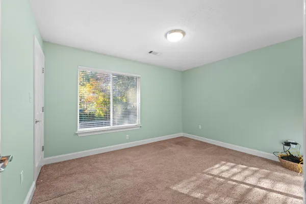a view of a house with a yard patio and swimming pool