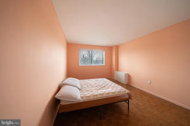 a bedroom with a bed and a closet