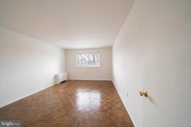 a view of an empty room and window