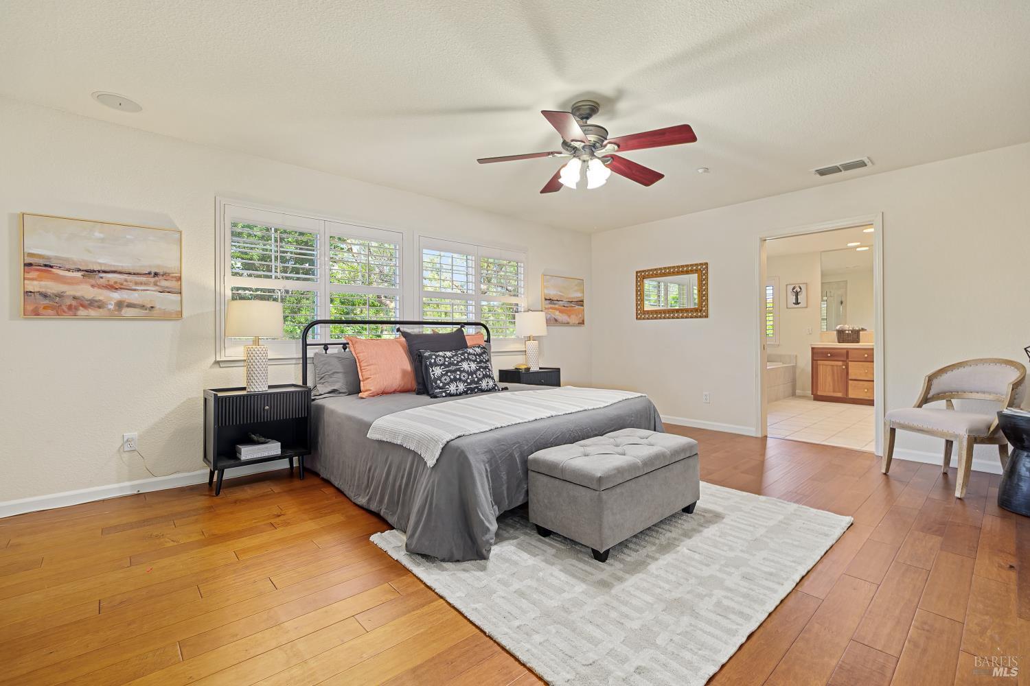 68 Pinheiro Circle Novato, CA 94945 - Photo 41 of 82 The generously sized primary suite is a true retreat, offering plenty of room for a sitting area while enjoying abundant natural light and peaceful backyard views. Direct access to the spa-inspired ensuite creates a relaxing private sanctuary.