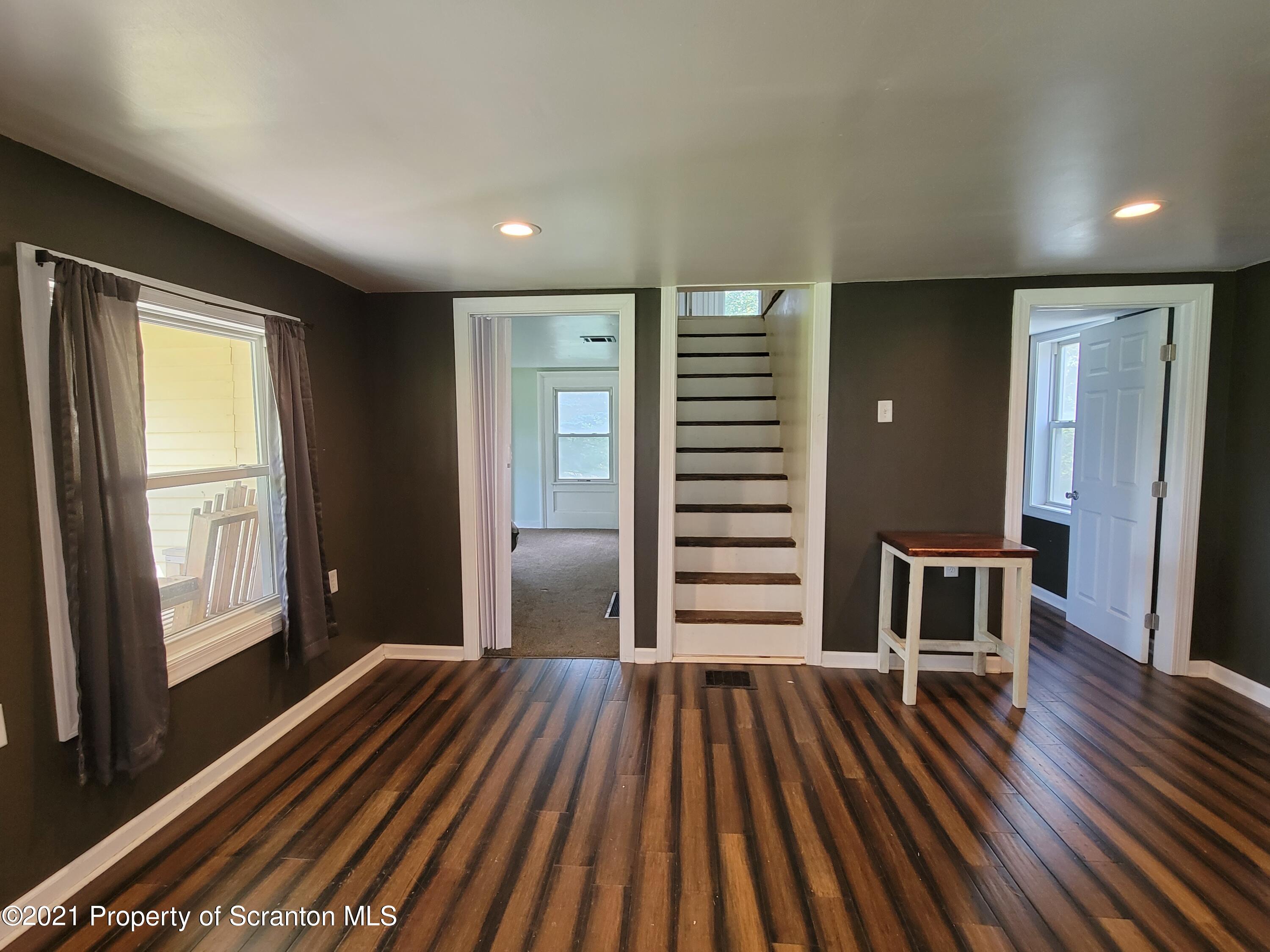 686 Wilcox Road Meshoppen, PA 18630 - Photo 14 of 30 a view of room with furniture and wooden floor