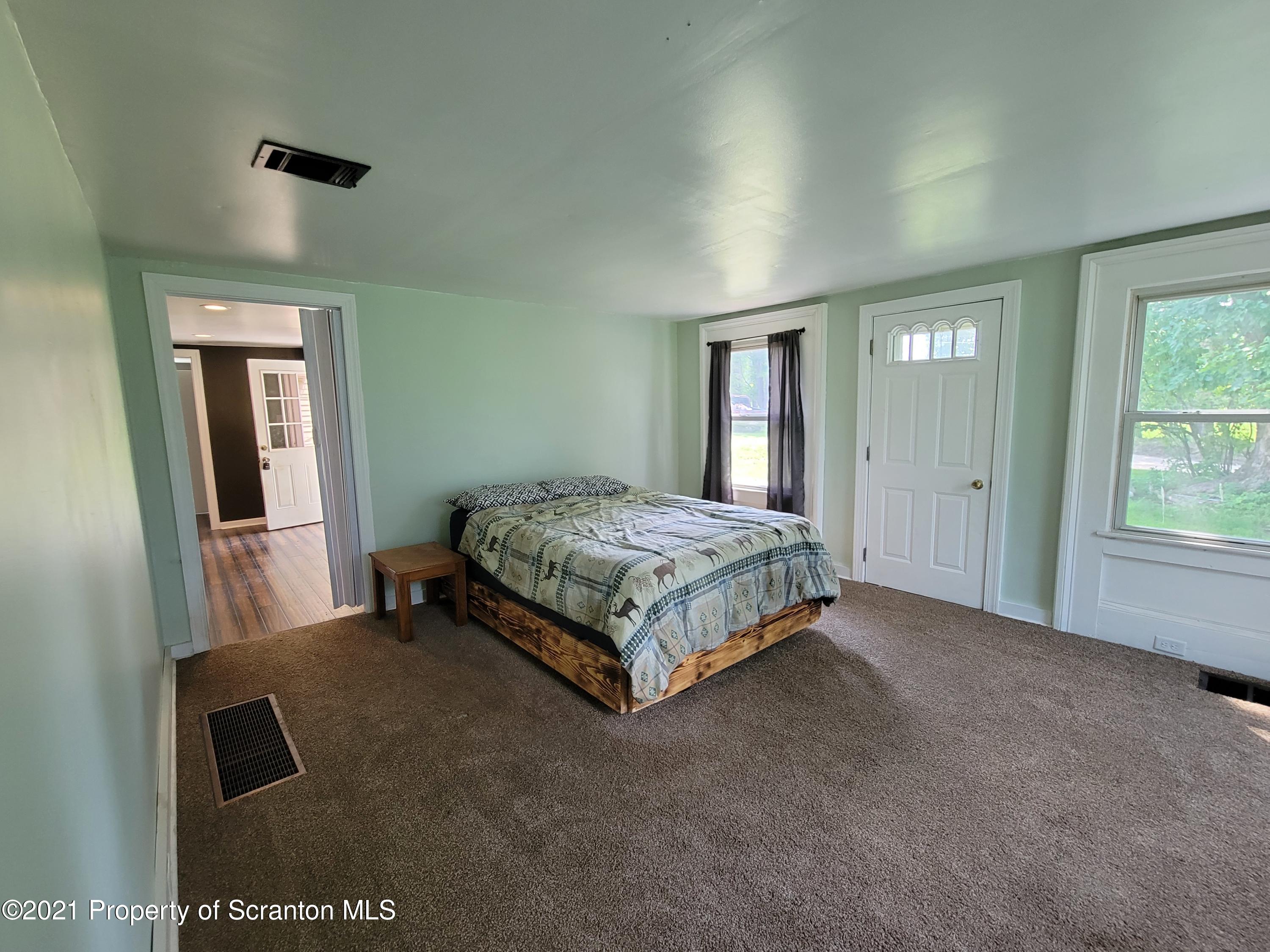 686 Wilcox Road Meshoppen, PA 18630 - Photo 19 of 30 a bedroom with a bed and window