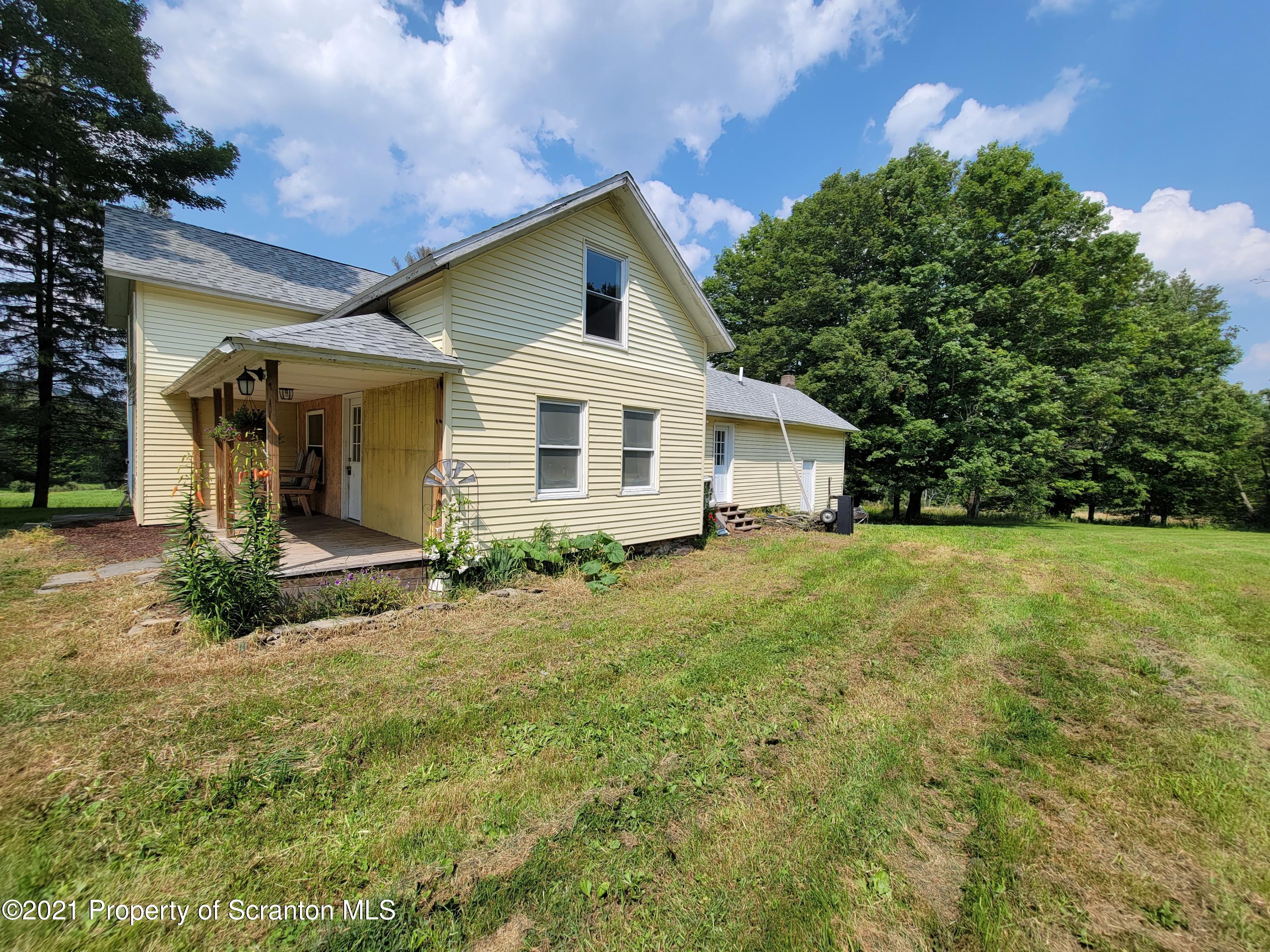 686 Wilcox Road Meshoppen, PA 18630 - Photo 2 of 30 a view of a house with backyard and garden
