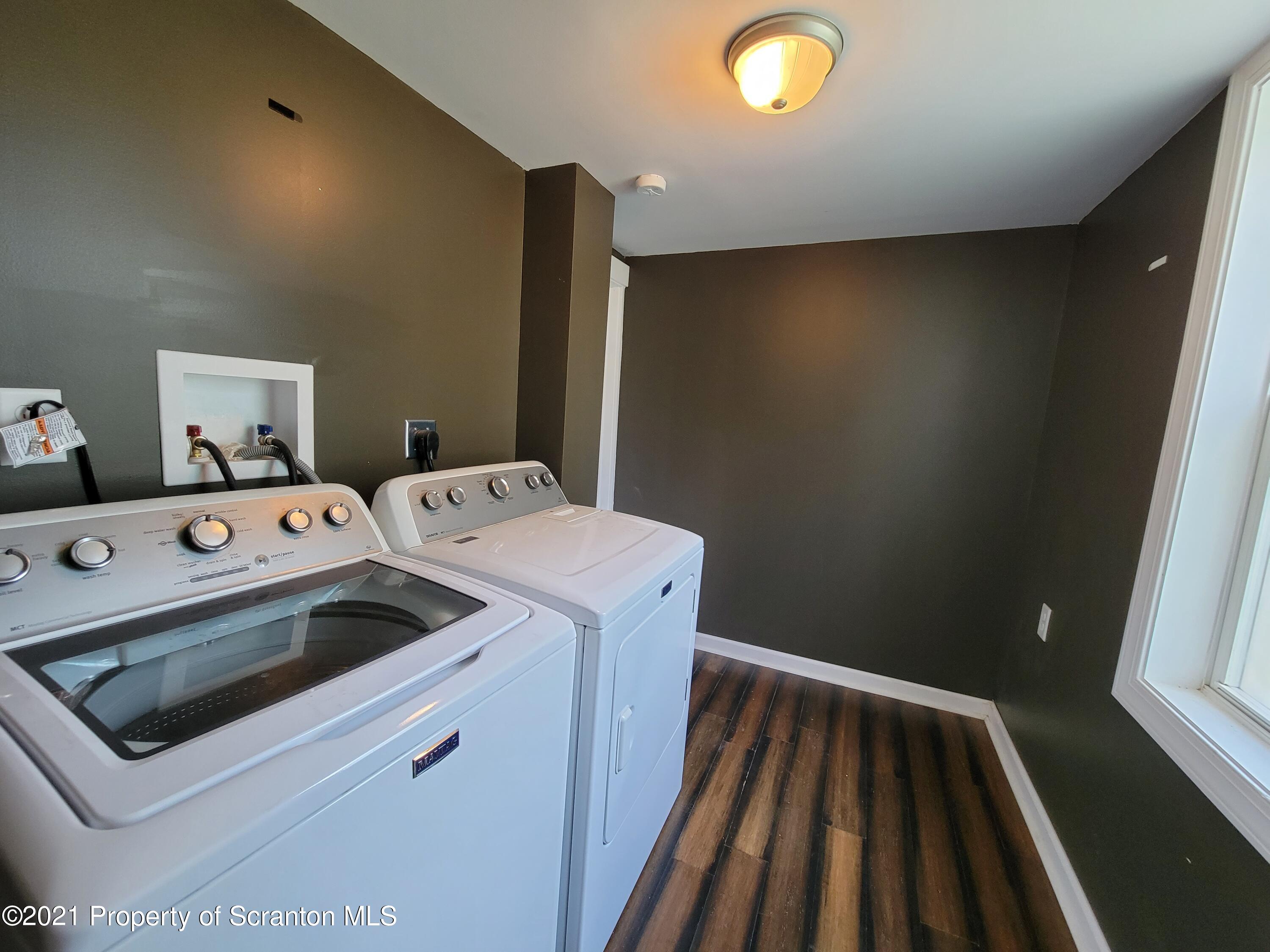 686 Wilcox Road Meshoppen, PA 18630 - Photo 21 of 30 a utility room with dryer and washer