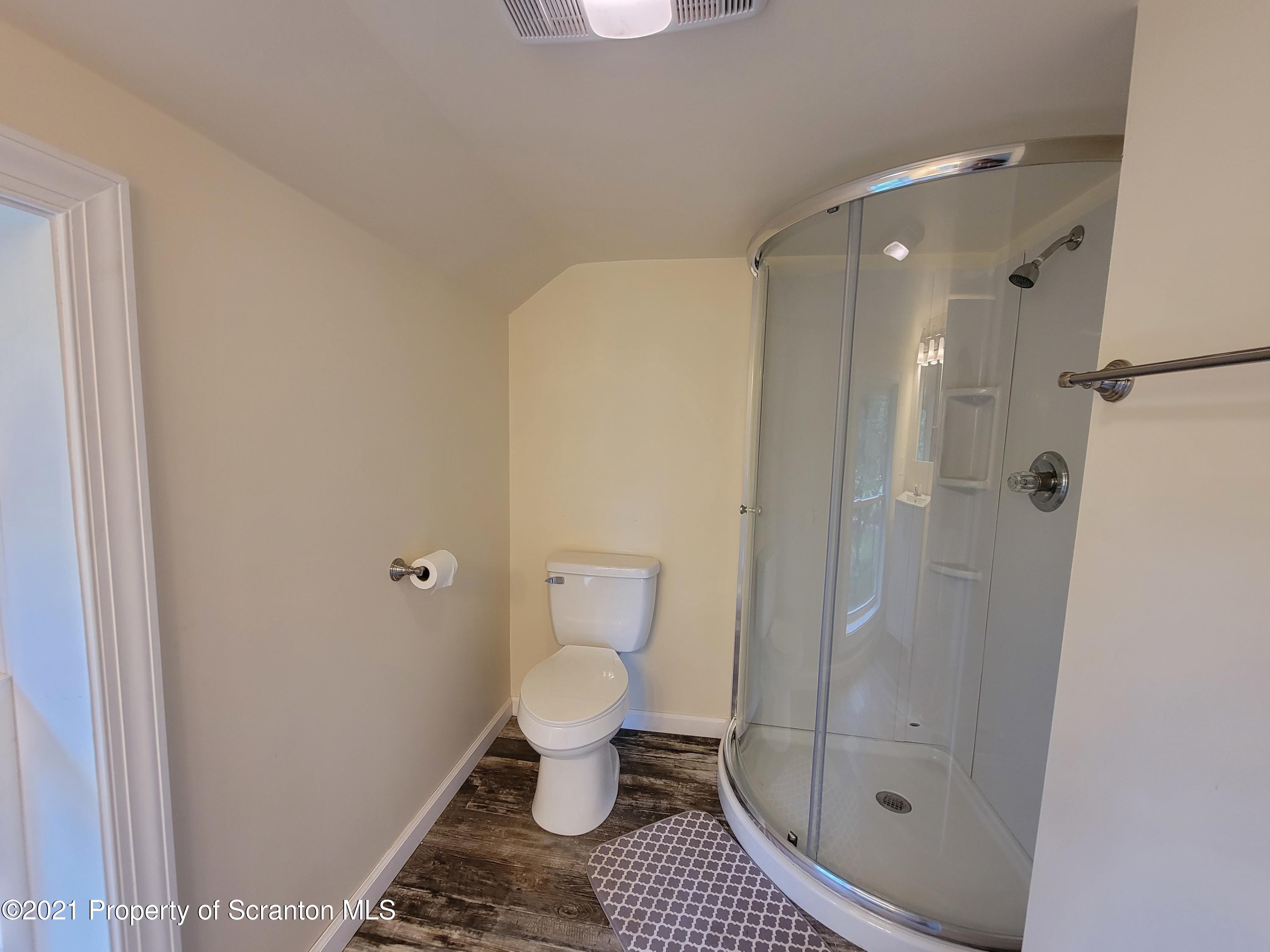 686 Wilcox Road Meshoppen, PA 18630 - Photo 22 of 30 a bathroom with a glass door shower