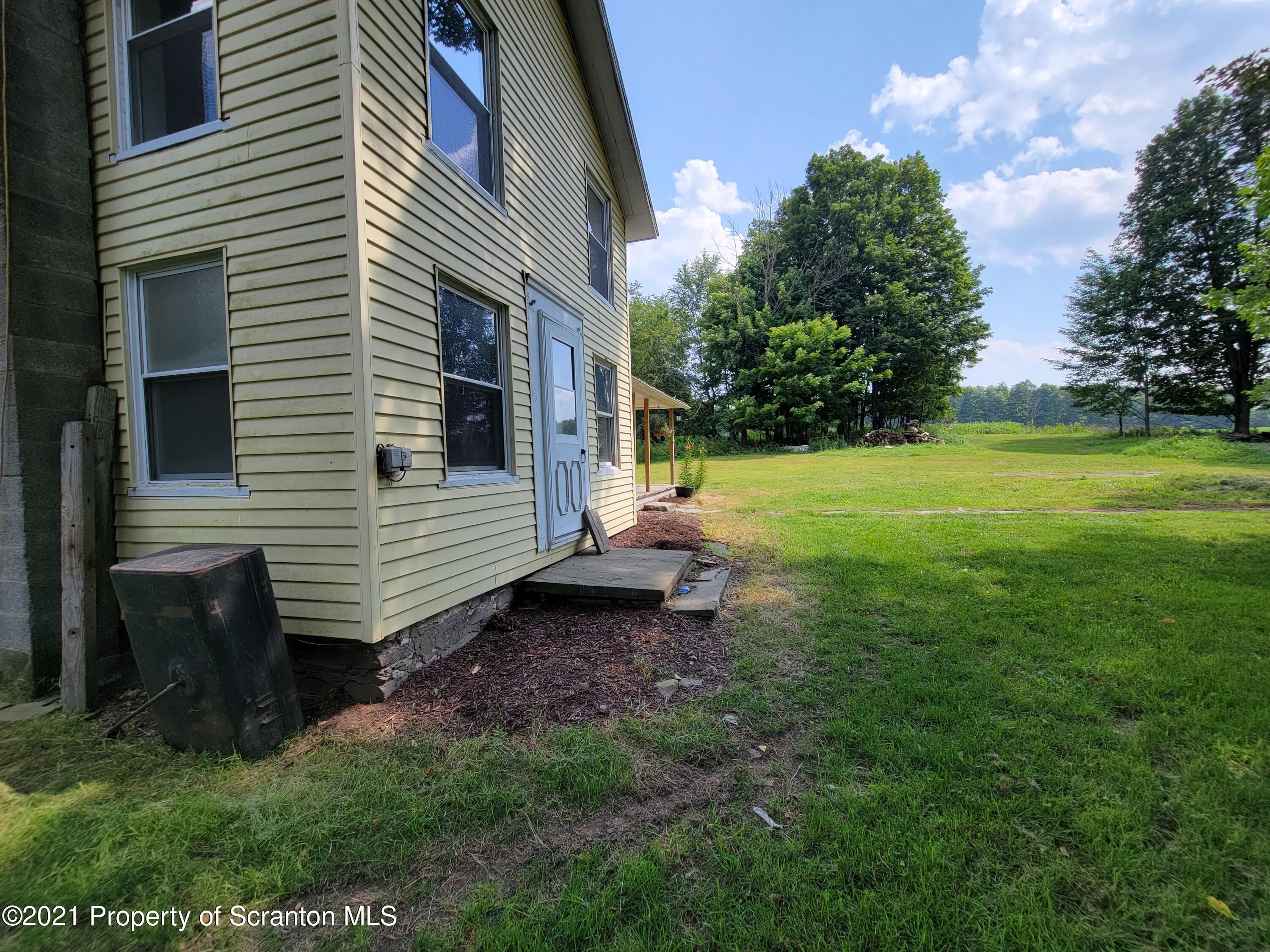 686 Wilcox Road Meshoppen, PA 18630 - Photo 6 of 30 a view of a backyard with a garden